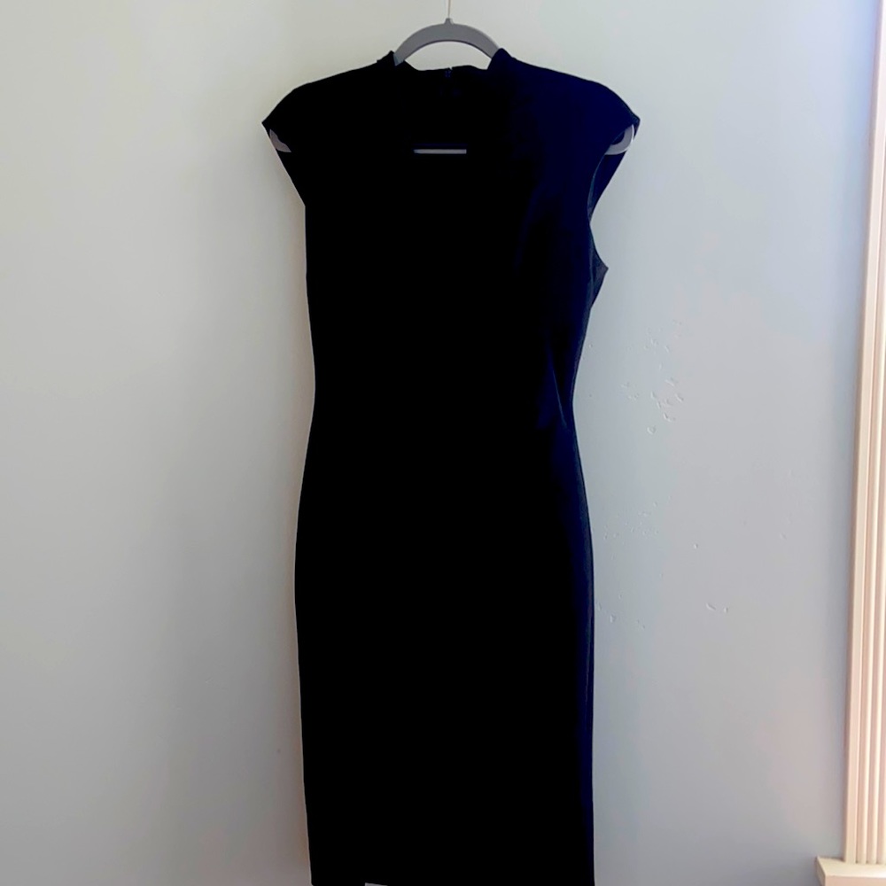 Karen Millen Dress. Size 8.  Black, form fitting & is a versatile, elegant style